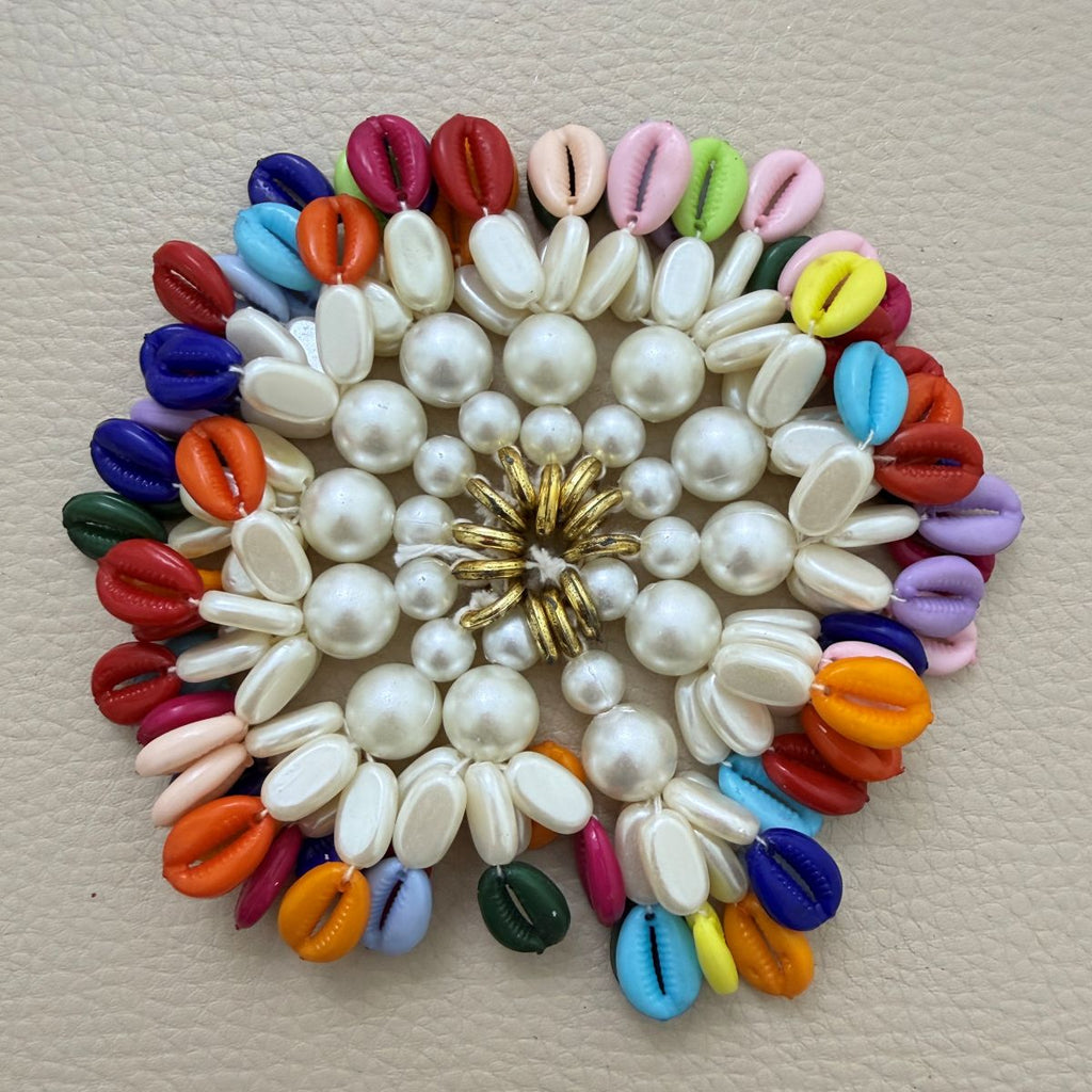 Close-up of multicolor kodi tassels with creamy white accents