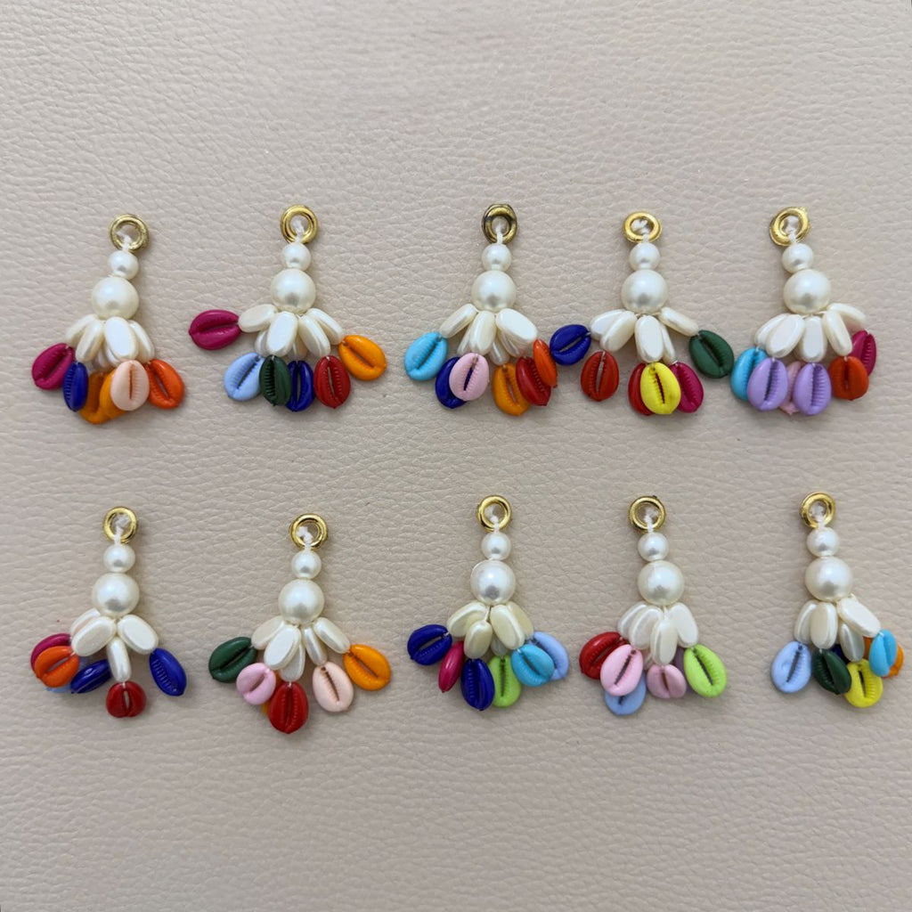 Assorted colorful cowrie tassels arranged in a circle