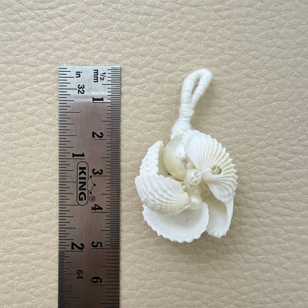 Group of white shell and pearl-look bead tassels with attachment loops