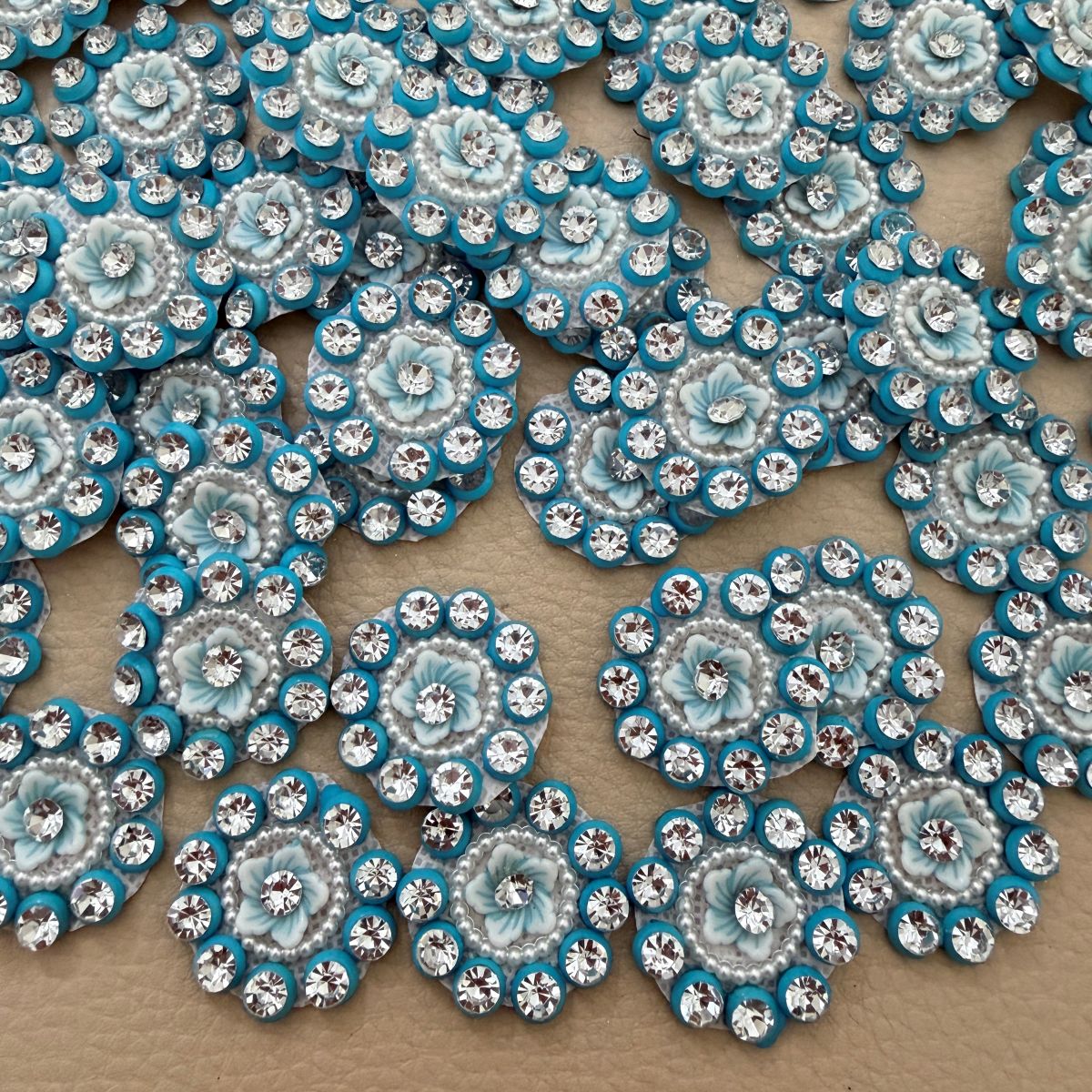Group of round pale blue floral rhinestone appliques