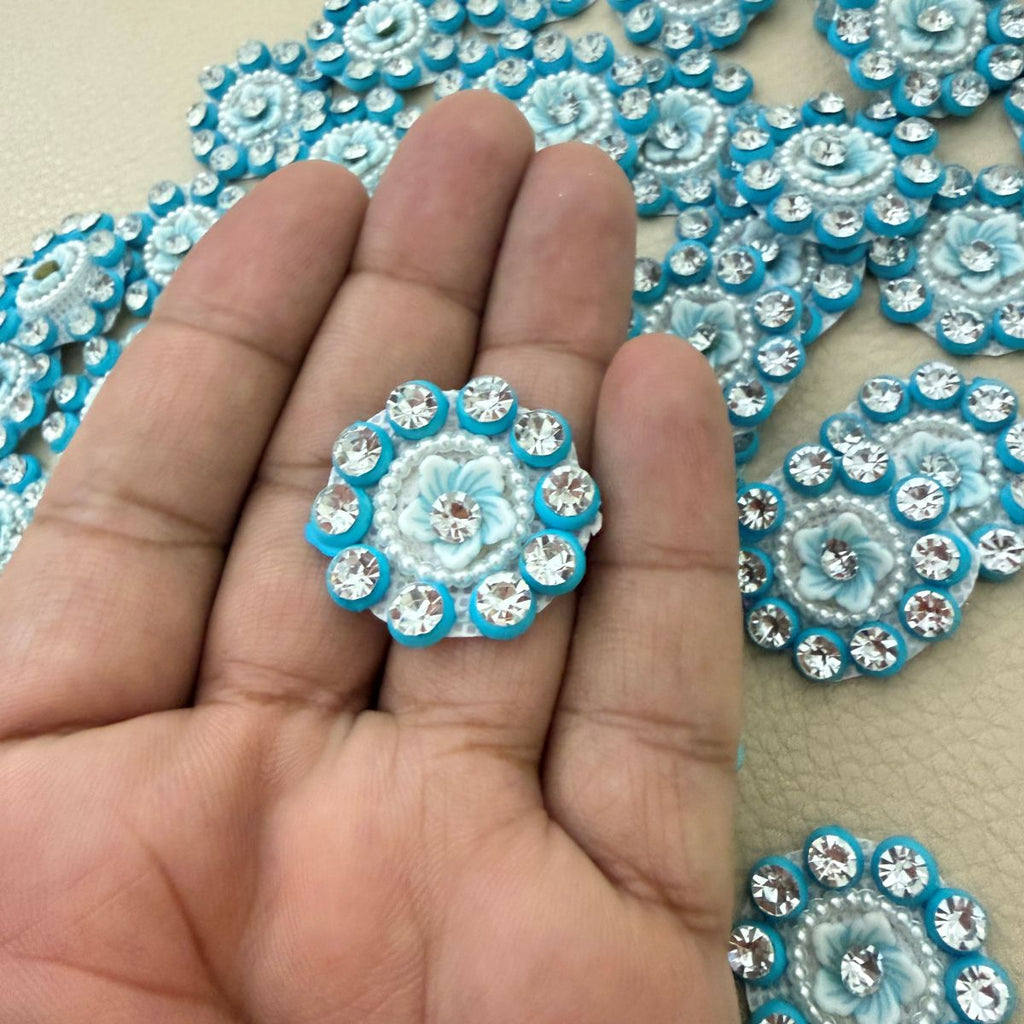 Front and mesh-style back of blue floral rhinestone appliques