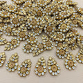 Group of gold-tone leaf and rhinestone teardrop appliques
