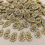 Group of gold-tone leaf and rhinestone teardrop appliques