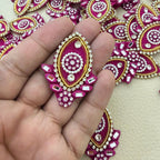 Pink teardrop applique held in hand
