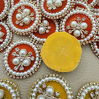 Plain yellow fabric reverse of a round decorative patch