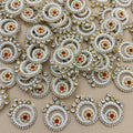 Collection of white pearl and rhinestone spiral patches with gold-tone settings