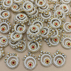 Collection of white pearl and rhinestone spiral patches with gold-tone settings