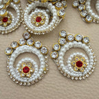 White pearl-look spiral patches with clear rhinestones and red floral centers