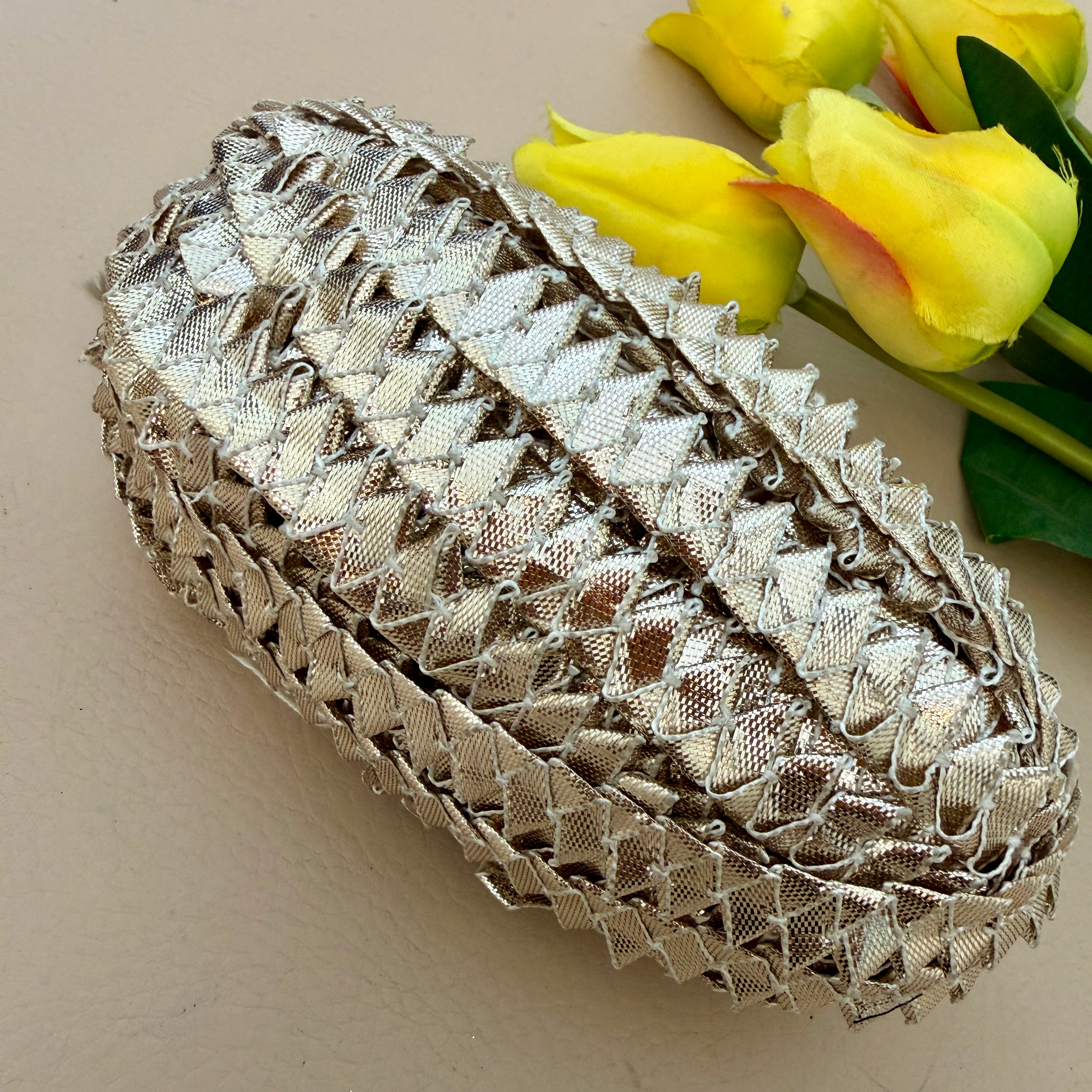 Decorative lace trim on a beige background with yellow tulips.