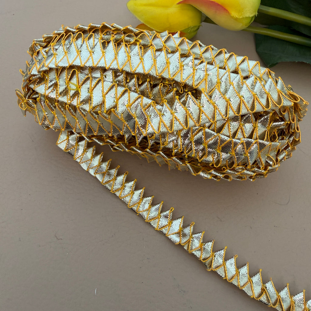 Decorative gold and silver trim on a neutral background