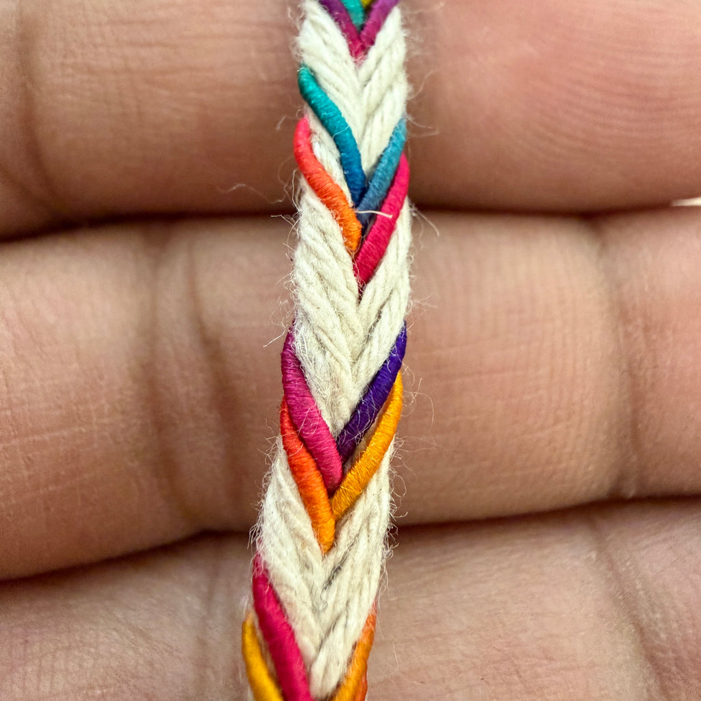 Colorful braided bracelet on a person's hand