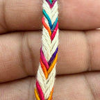 Colorful braided bracelet on a person's hand