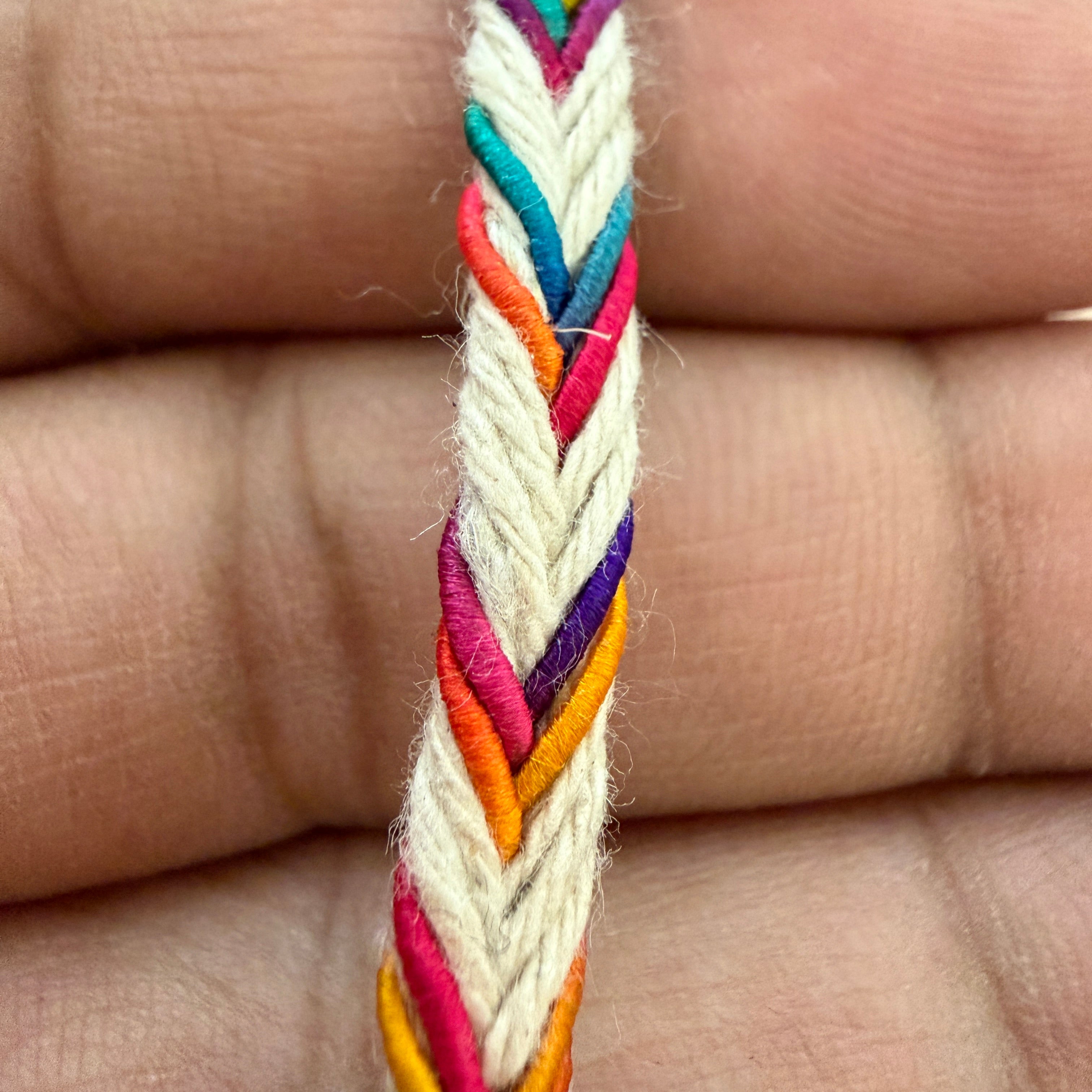 Colorful braided bracelet on a person's hand