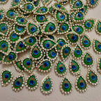 Decorative peacock feather patterns with blue centers on a beige background