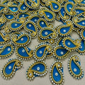 Decorative elements with blue, gold, and silver colors on a beige background