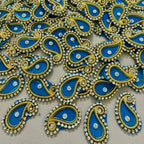 Decorative elements with blue, gold, and silver colors on a beige background