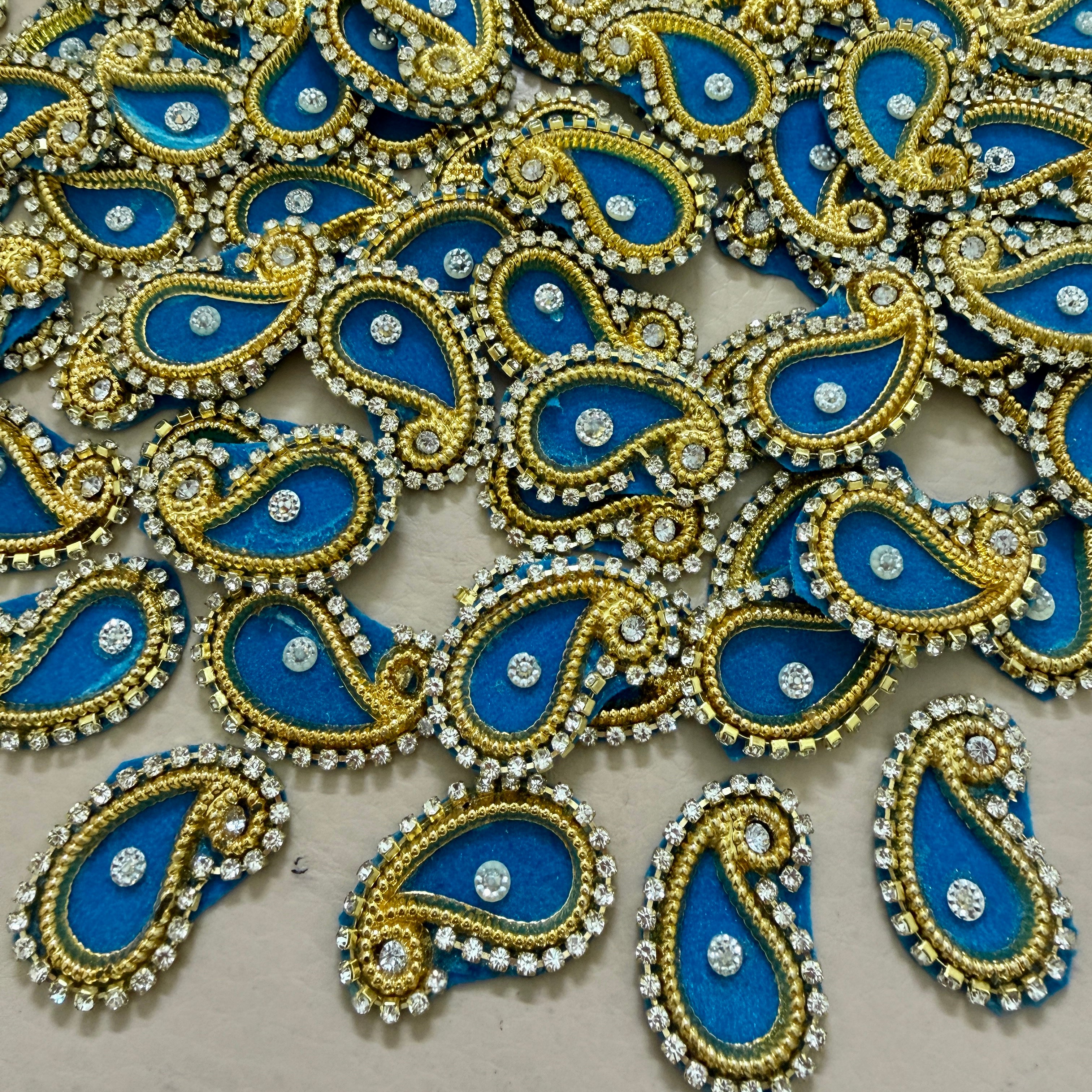 Decorative elements with blue, gold, and silver colors on a beige background
