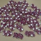 Decorative purple and white embellishments on a beige background