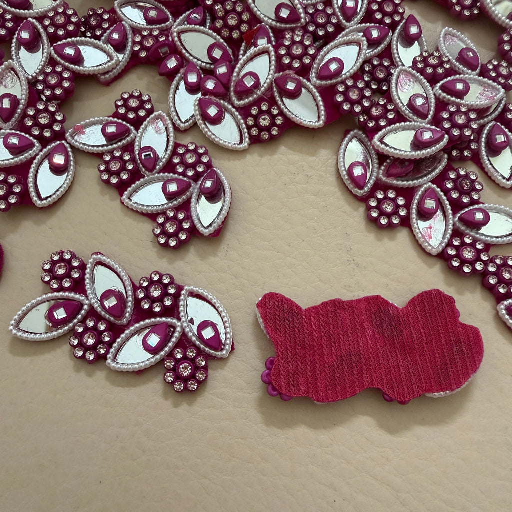 Decorative red and white embellishments on a beige surface