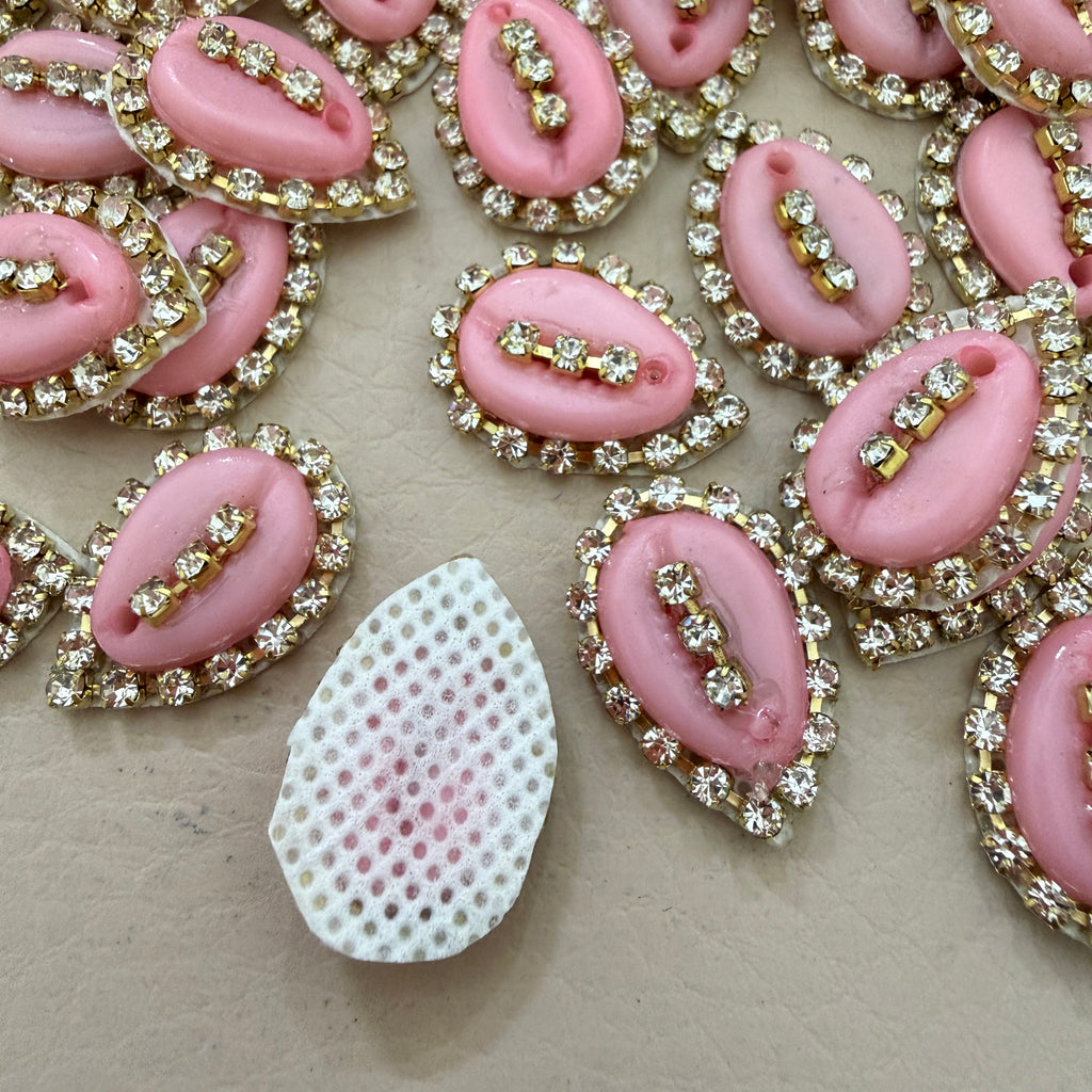 Pink and gold decorative elements on a beige background