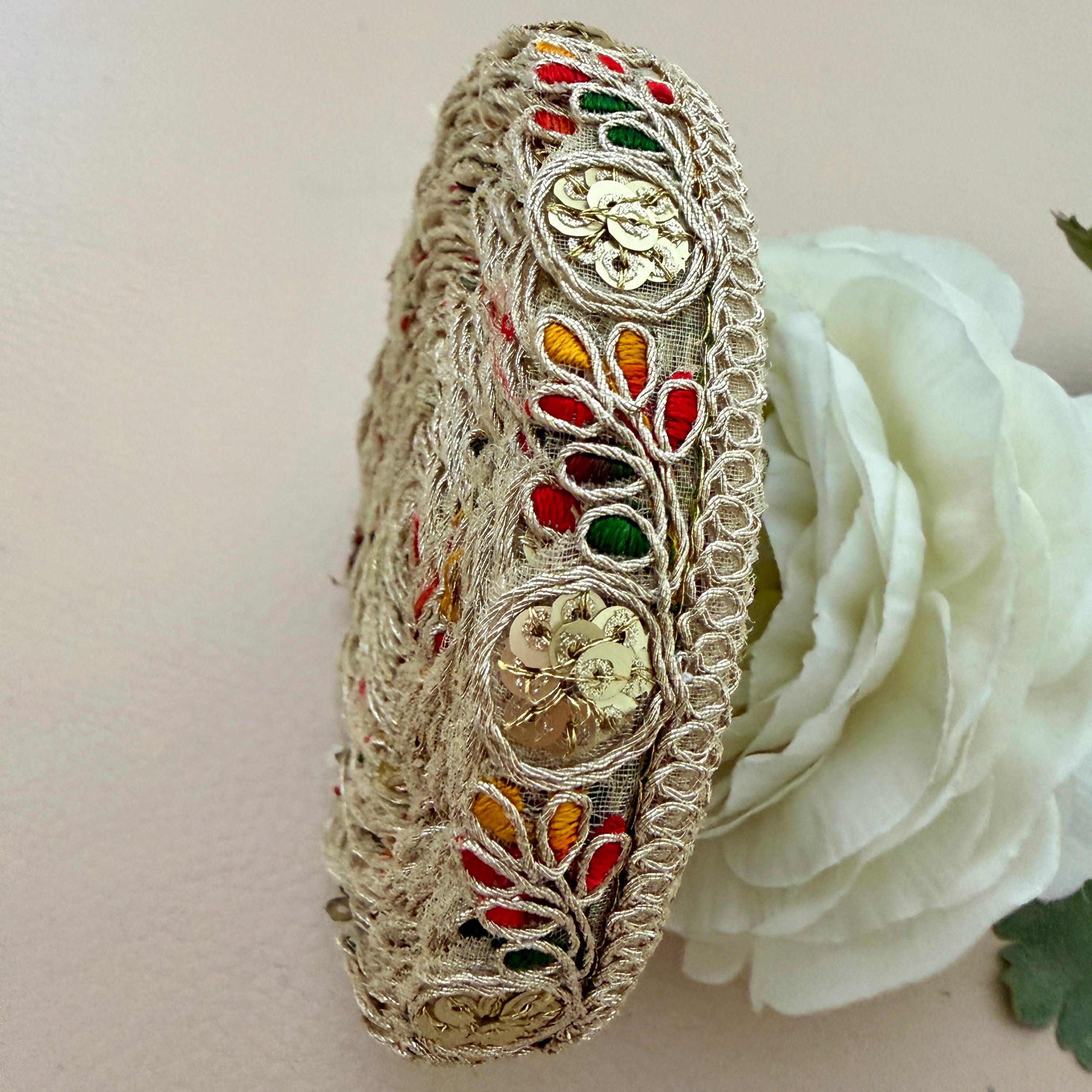 Decorative Lace with colorful embroidery on a white flower background