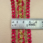 Decorative pink and gold trim with a ruler for scale on a beige background
