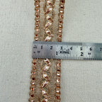 Decorative lace trim with a ruler for measurement on a neutral background