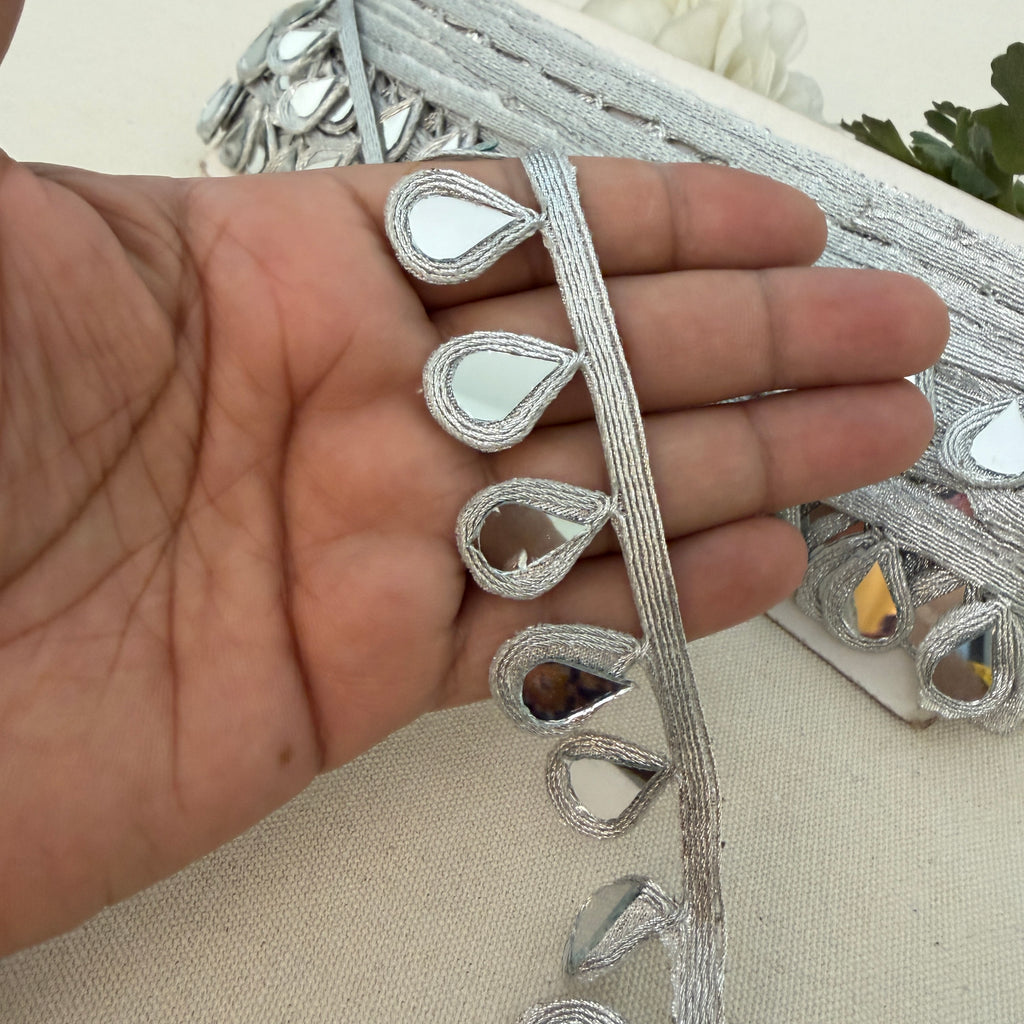 Decorative planter with reflective teardrop designs