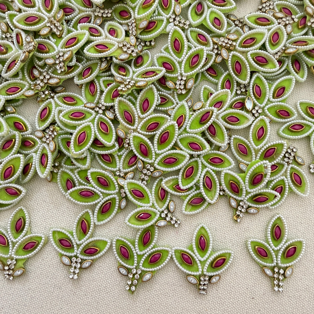 Decorative fabric with green and red leaf patterns on a beige background