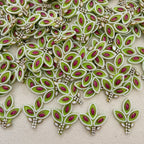 Decorative fabric with green and red leaf patterns on a beige background