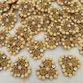 Decorative embellishments with gold and beige patterns on a textured surface