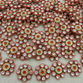 Close-up of decorative embellishments with rhinestones on a light background