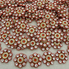 Close-up of decorative embellishments with rhinestones on a light background