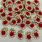 Decorative elements with red roses and gold and silver embellishments on a light background