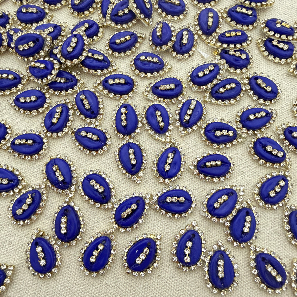 Pattern of blue and silver decorative elements on a beige background