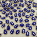 Pattern of blue and silver decorative elements on a beige background