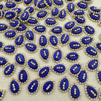 Pattern of blue and silver decorative elements on a beige background