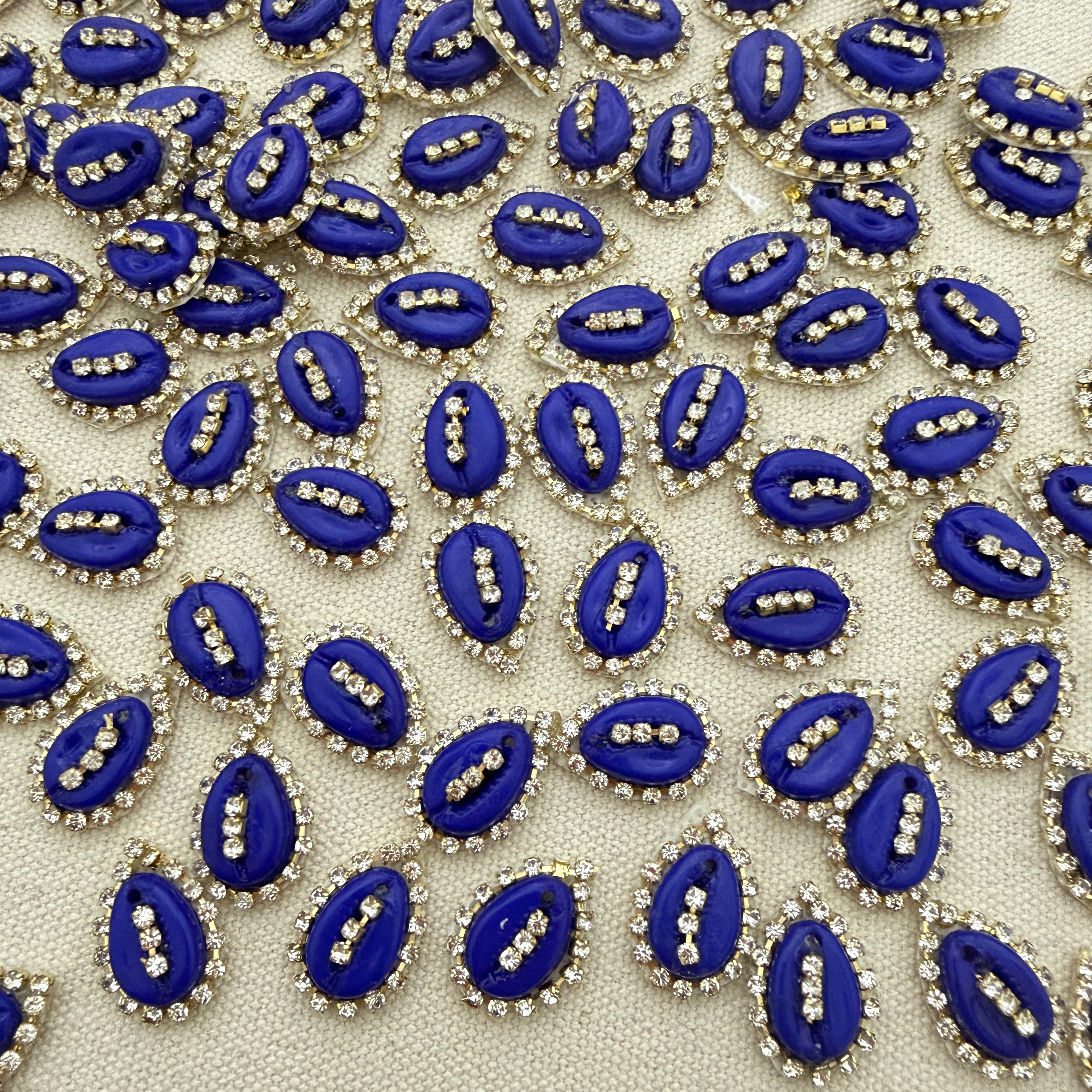 Pattern of blue and silver decorative elements on a beige background