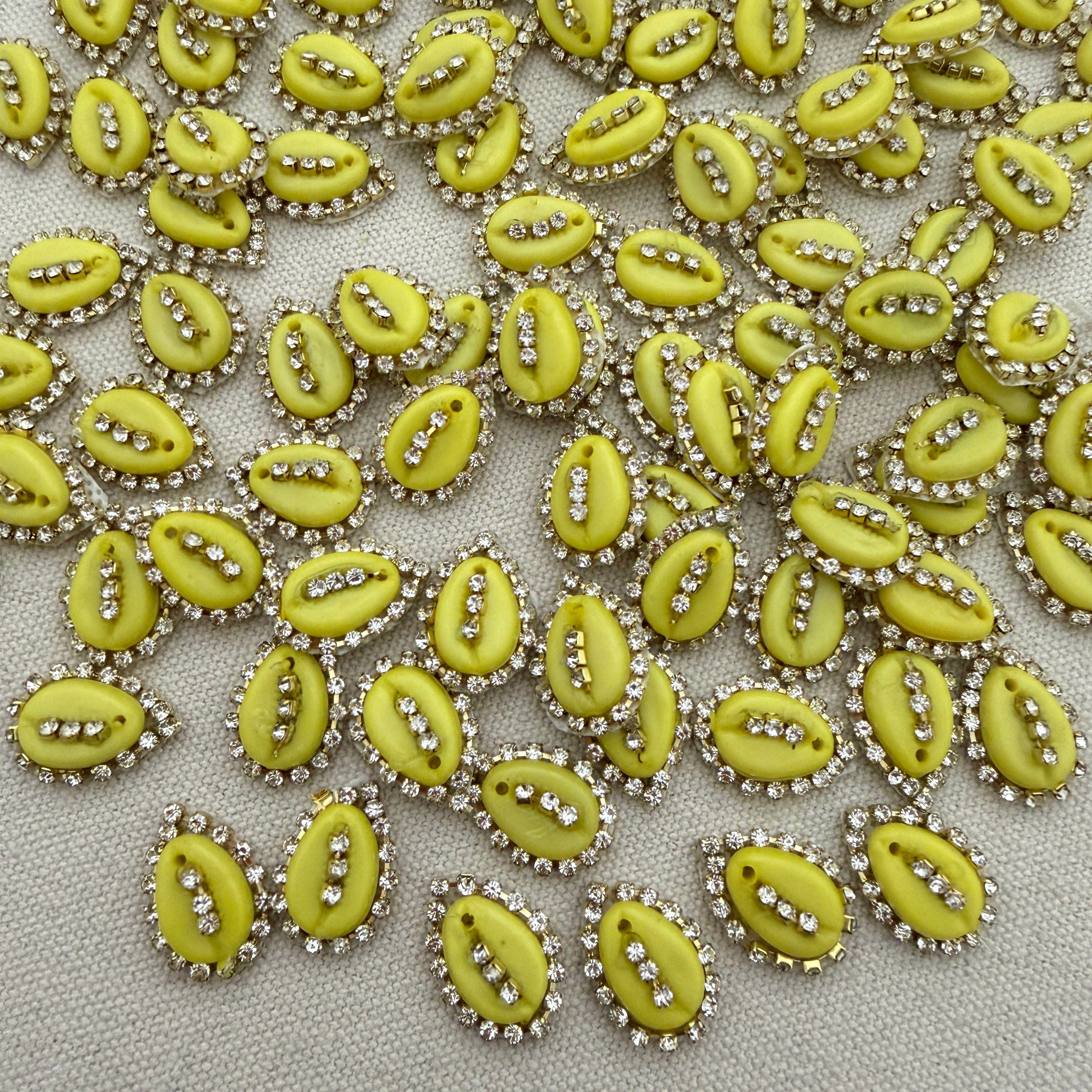 Green kiwi slices with decorative elements on a textured fabric background