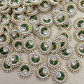 Close-up of decorative elements with pearls, green leaves, and crystals on a beige background