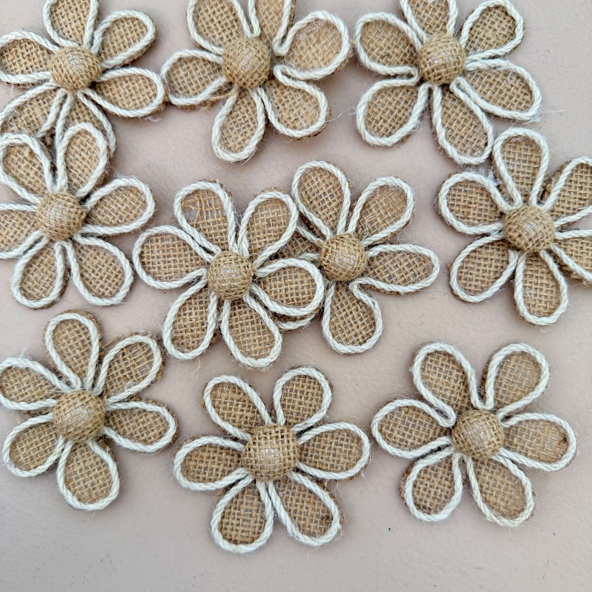 Burlap daisy flower patch with rope border next to ruler showing size