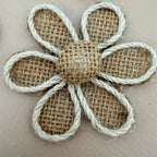 Close-up of burlap daisy flower patch with twisted white rope border