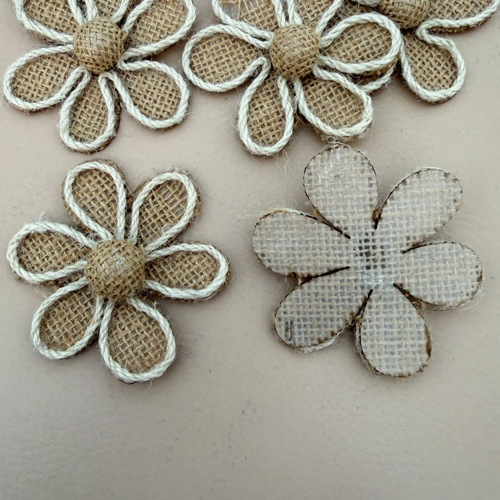 Multiple burlap daisy flower patches laid out flat