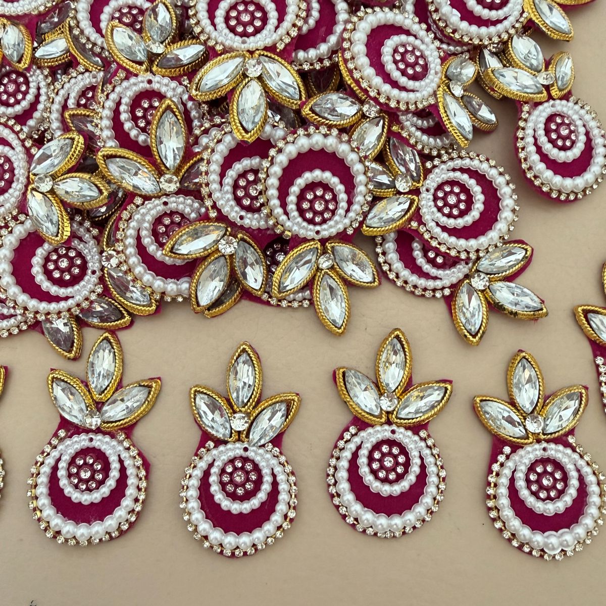 Magenta Kundan Pearl Crystal Applique Patch held in hand showing front detail