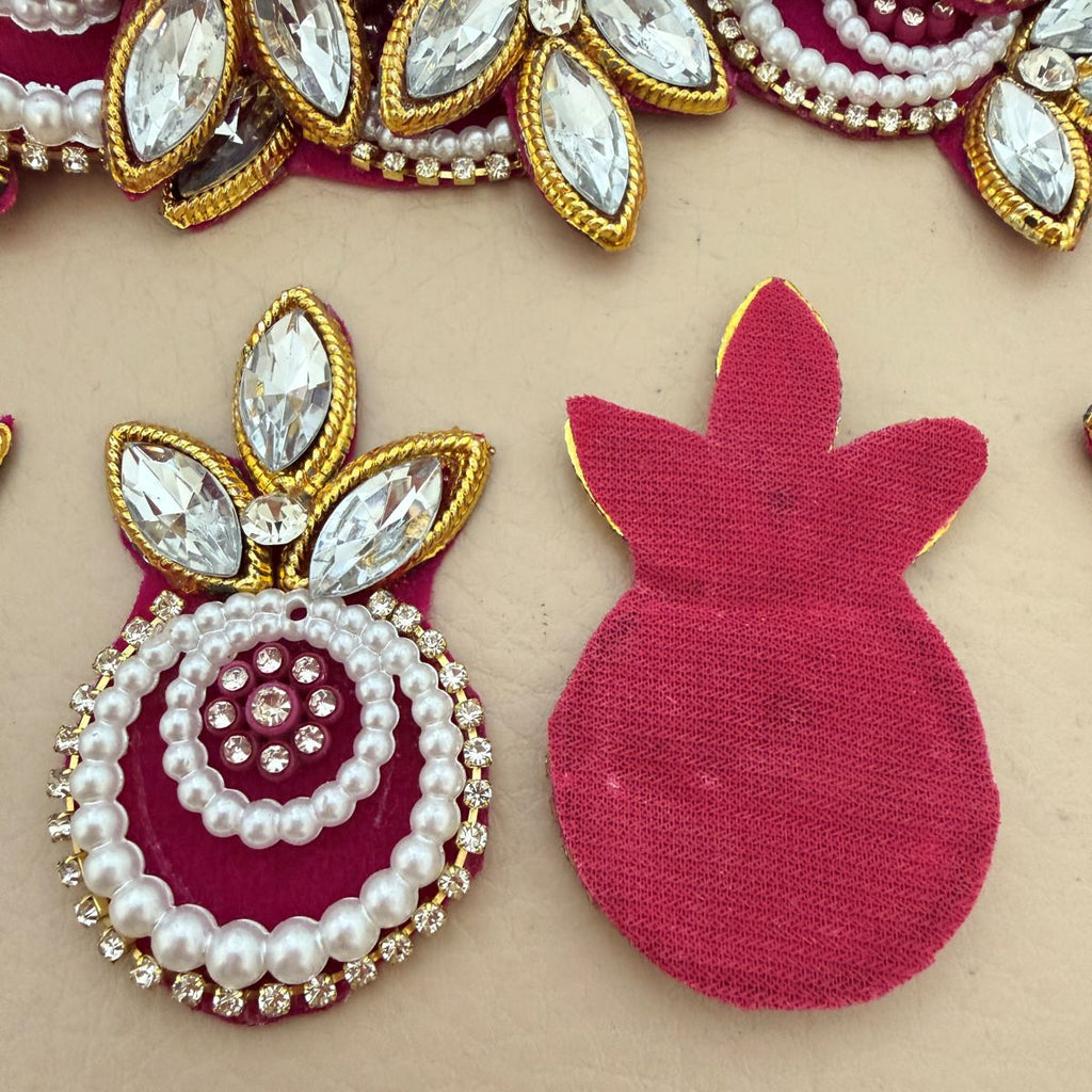Close-up of two Magenta Kundan Pearl Crystal Applique Patches side by side