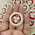Front and back view of round pearl rhinestone patch showing non-woven backing