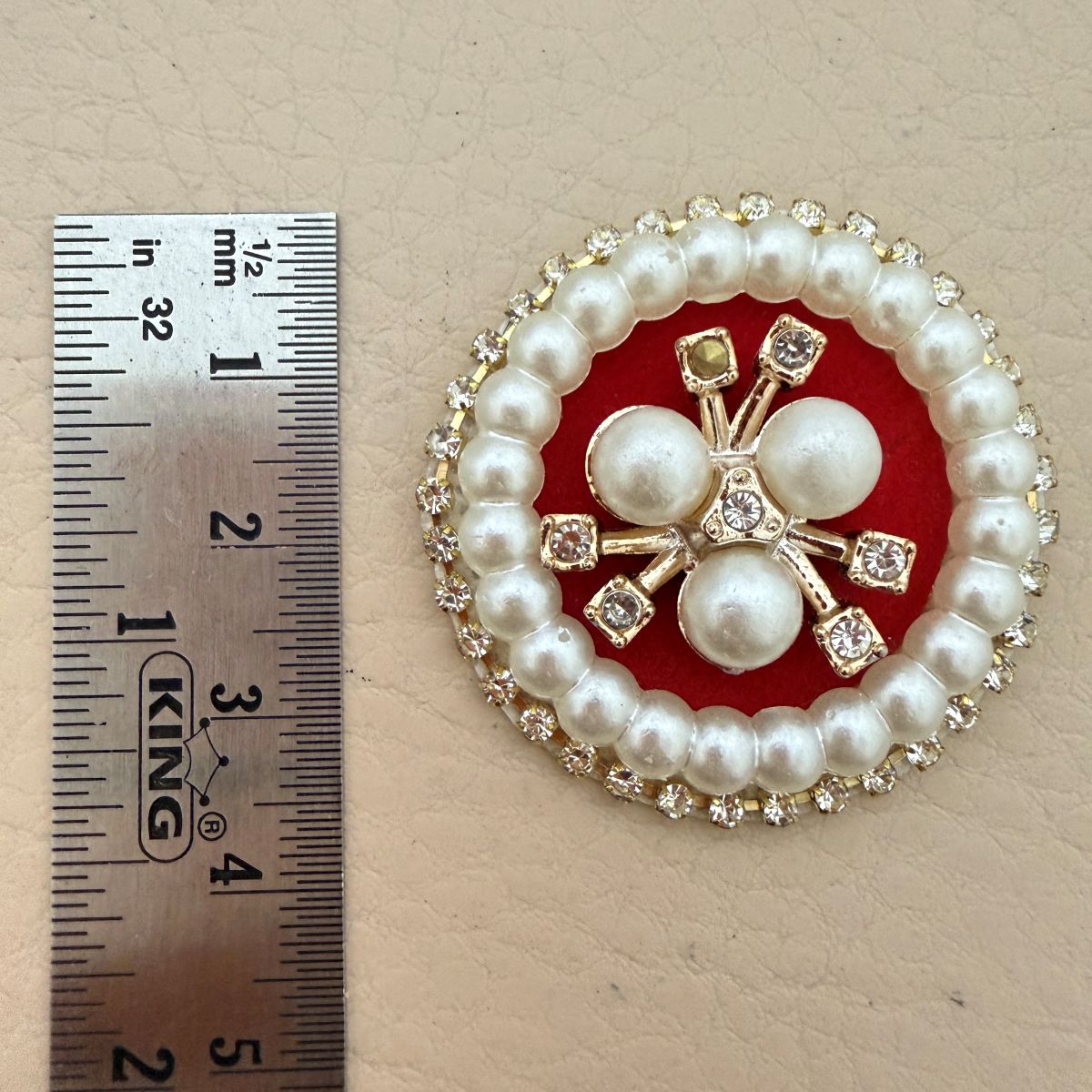 Size reference – 45mm pearl rhinestone patch next to ruler