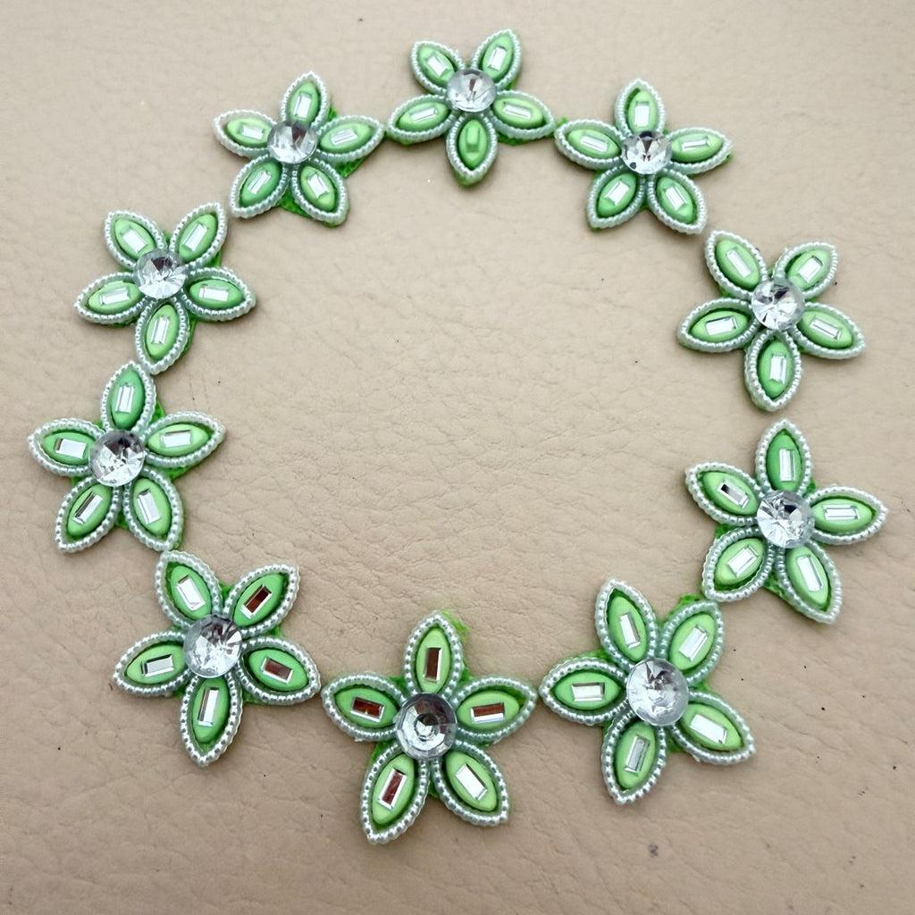Mint green rhinestone flower patches bulk view
