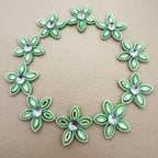 Mint green rhinestone flower patches bulk view