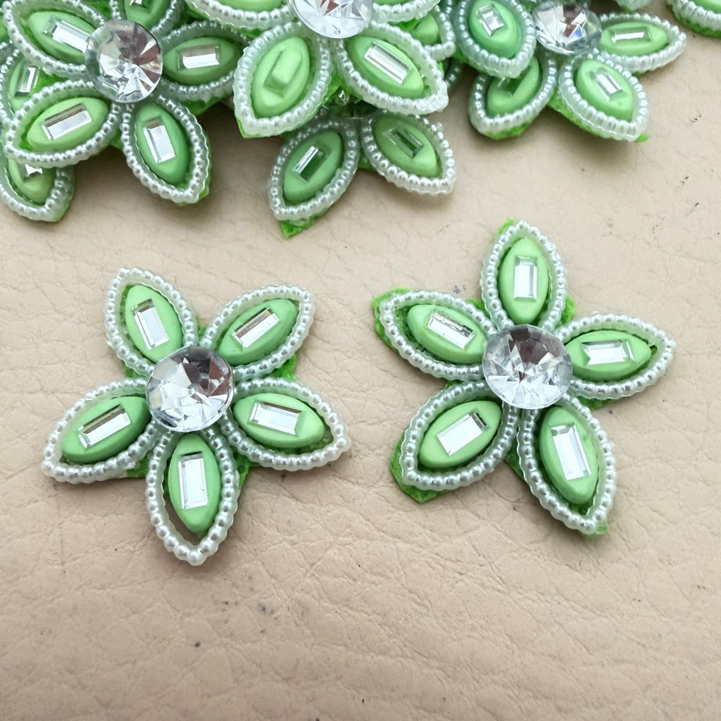 Front and back view of green rhinestone flower patch